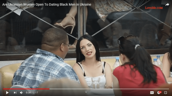 American man sitting and talking to Ukrainian women