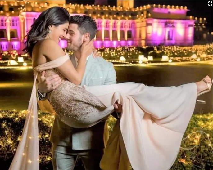 Nick picking up his wife Priyanka